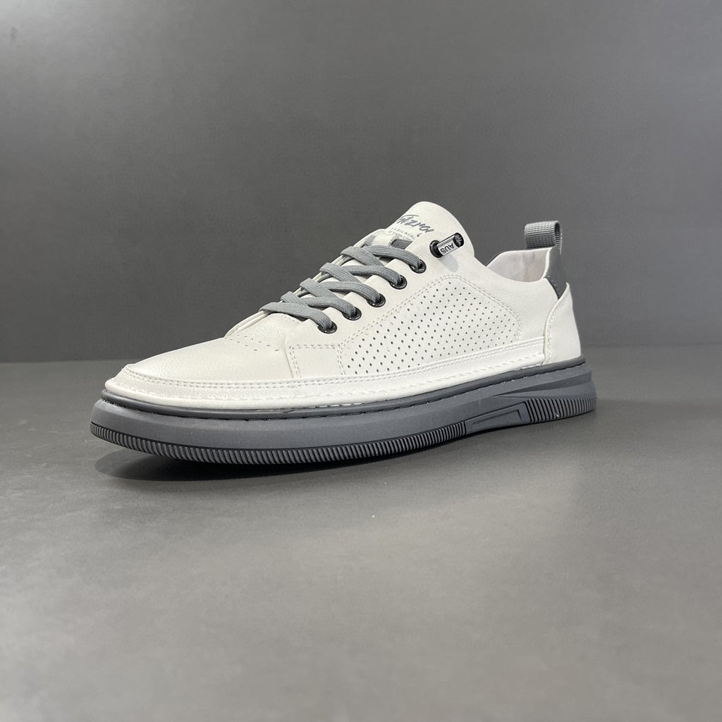 White perforated leather low-top sneaker with gray sole, side view