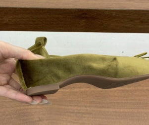 Side view of an olive square-toe ballet flat showing the flat sole