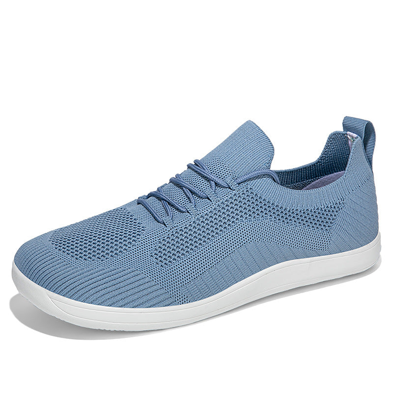 Light blue knit sneaker with white sole, side view