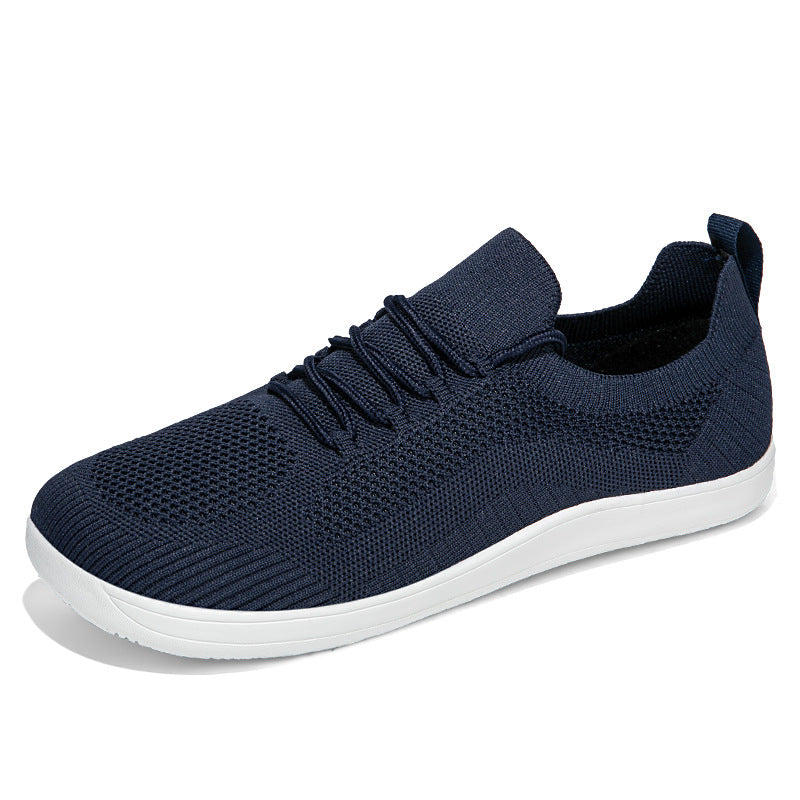 Navy knit sneaker with white sole, side view