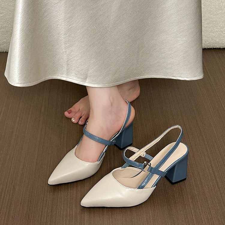Cream and blue two-tone slingback, one worn and one on the floor