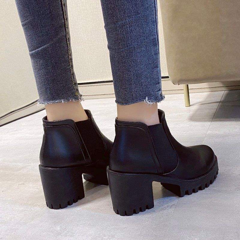 Back view of black Chelsea ankle boots showing the chunky block heels