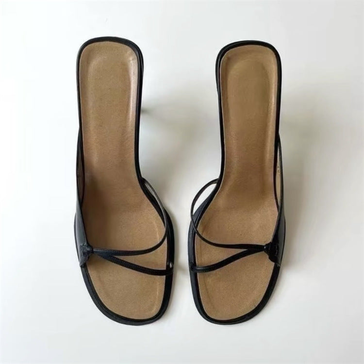 Black strappy heeled sandals side by side, top view