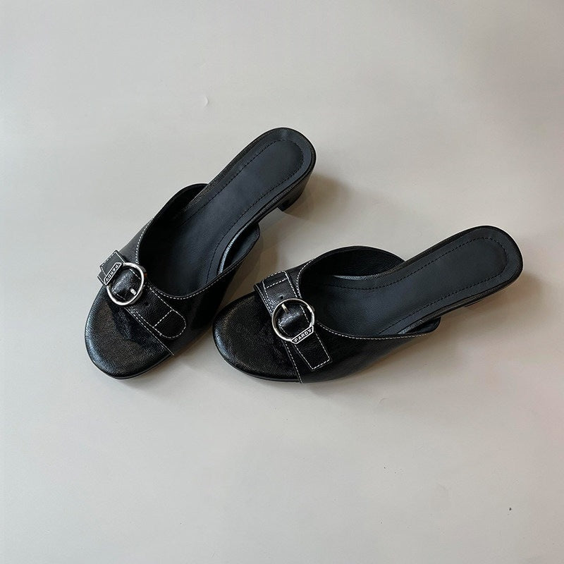 Pair of black square-toe kitten-heel mules with buckle straps