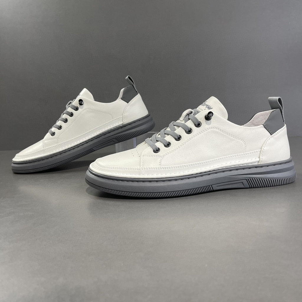 Men's white leather low-top sneakers with gray soles, smooth and perforated