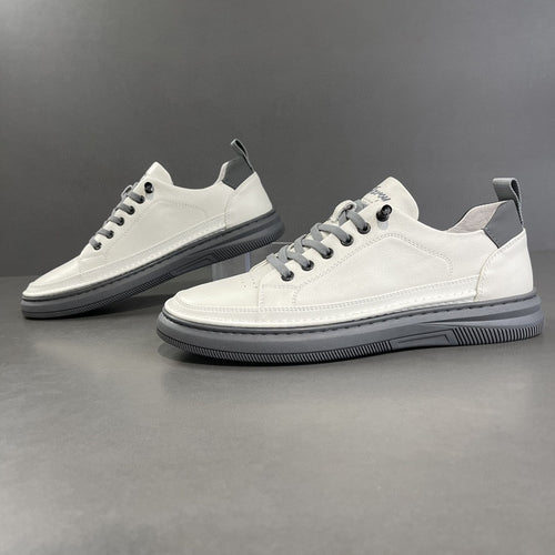 Men's white leather low-top sneakers with gray soles, smooth and perforated