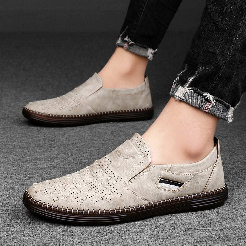 Man wearing beige perforated slip-on shoes with cuffed jeans