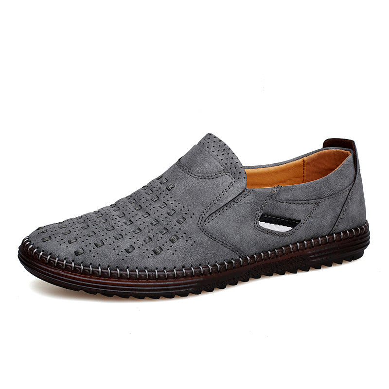 Gray perforated slip-on shoe with stitched sole, side view