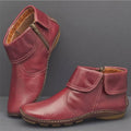 Pair of red fold-over ankle boots with side zippers