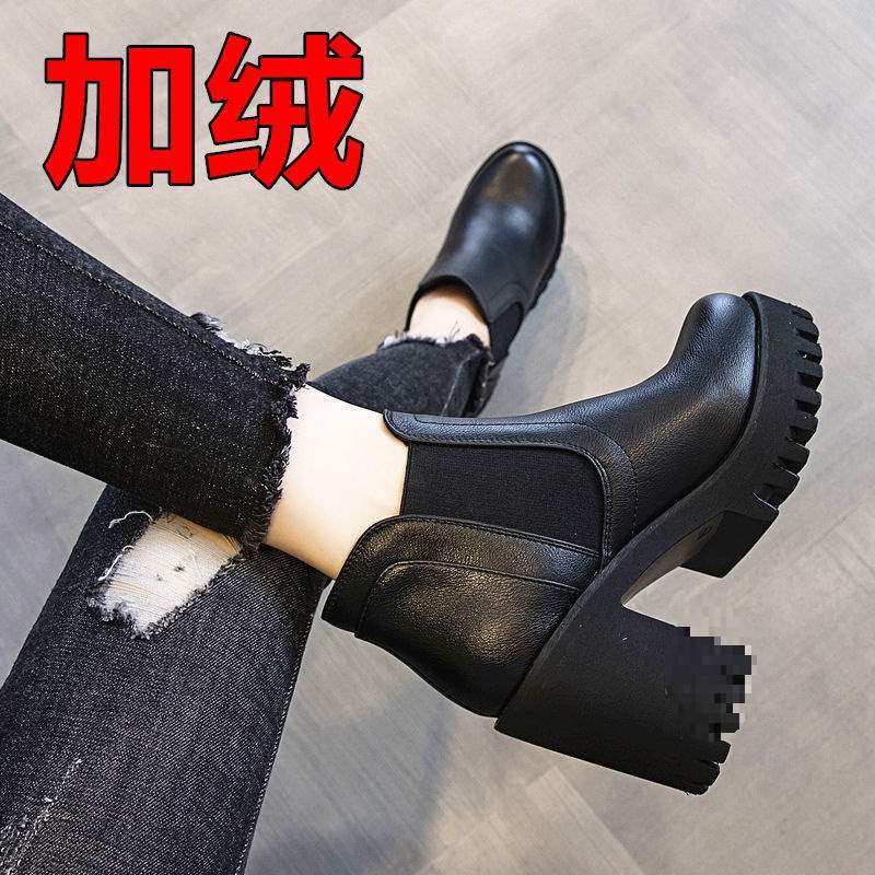 Fleece-lined black Chelsea ankle boots worn with black jeans