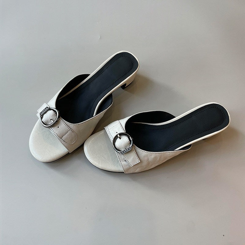 Pair of off-white square-toe kitten-heel mules with buckle straps