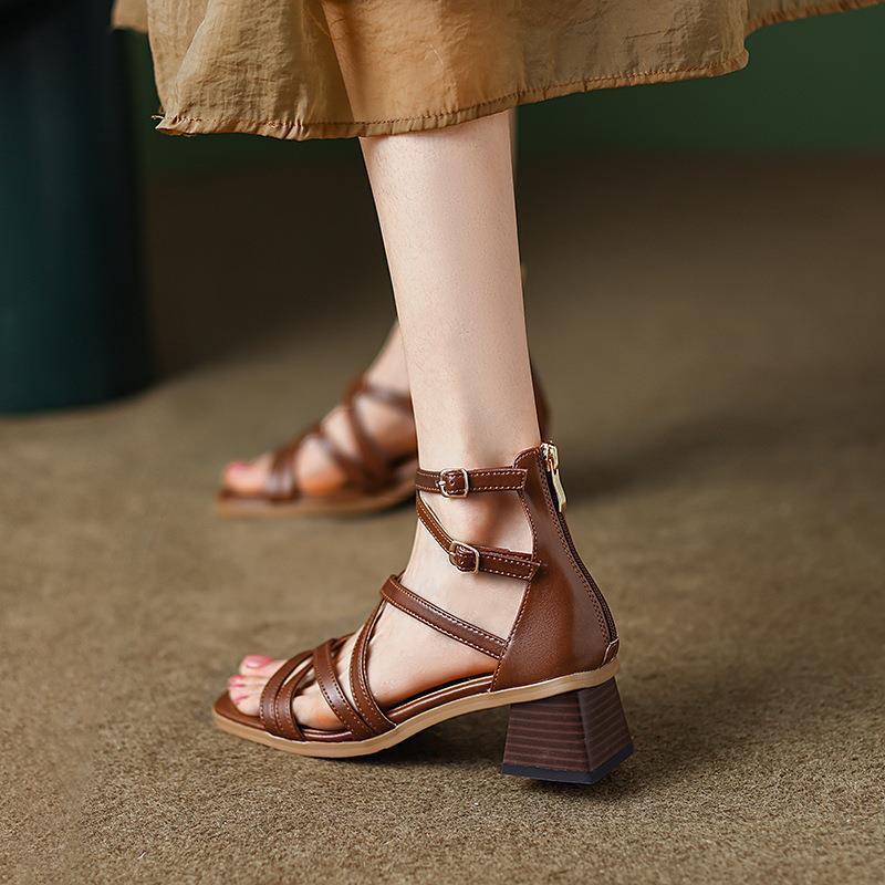 Brown strappy block-heel sandal with double ankle buckles, side view