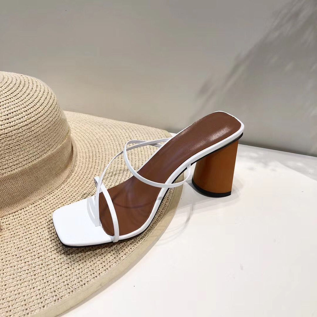 White strappy square-toe sandal with round block heel, side view