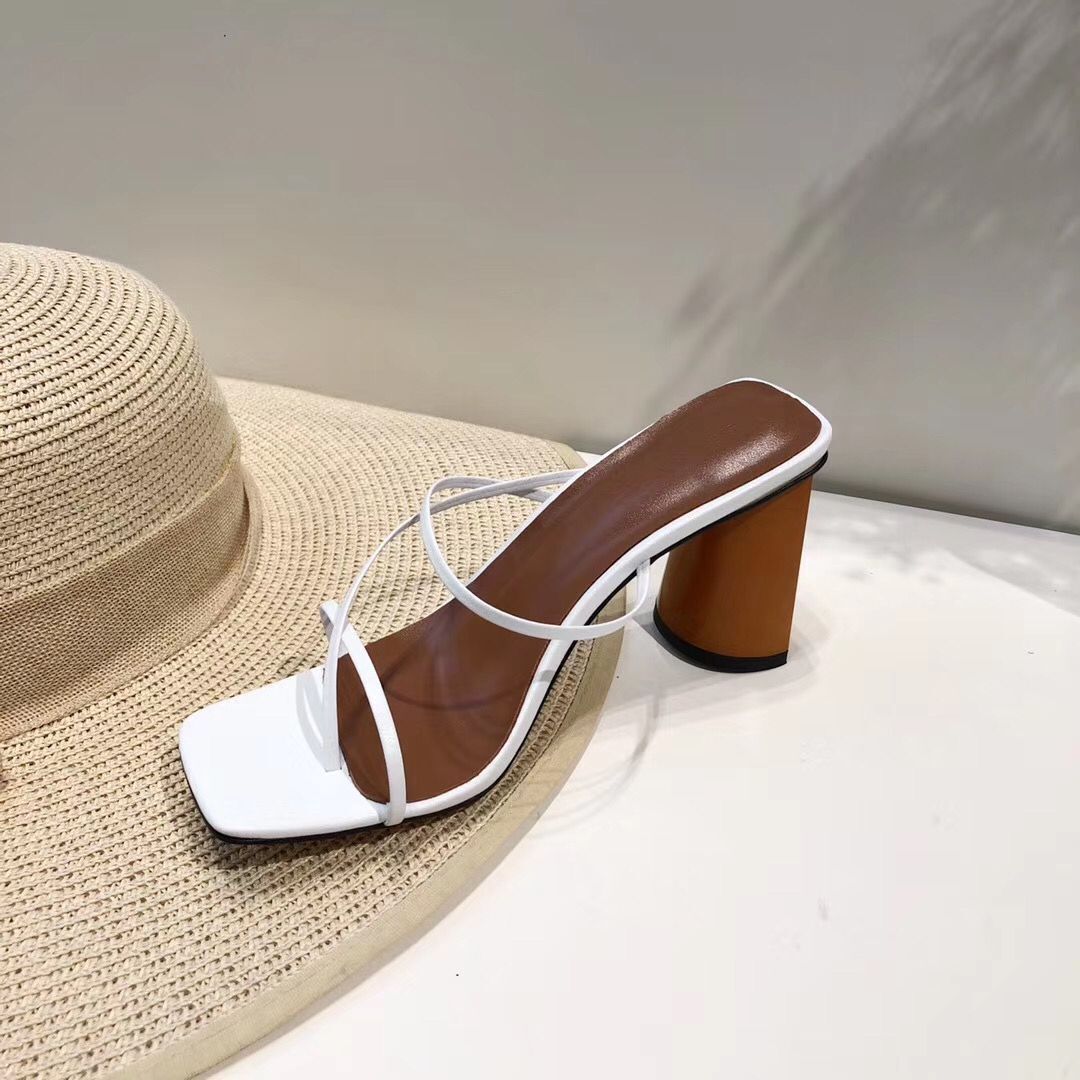 White strappy square-toe sandal with round block heel, side view