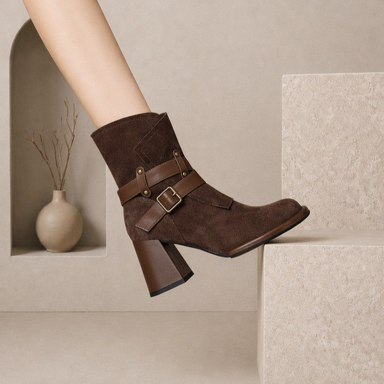 Brown suede ankle boot with double buckle strap and block heel, side view on foot