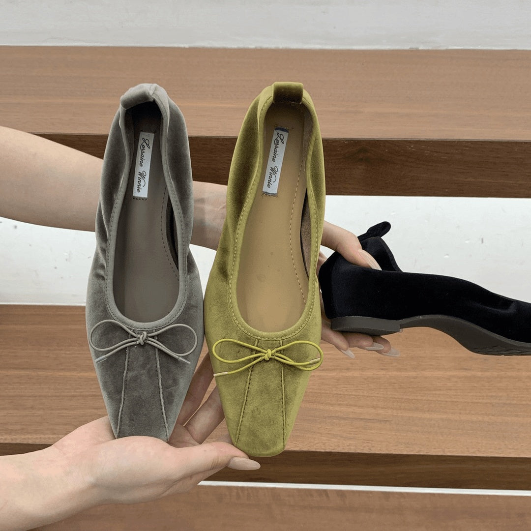 Gray and olive square-toe ballet flats with bows next to a black pair